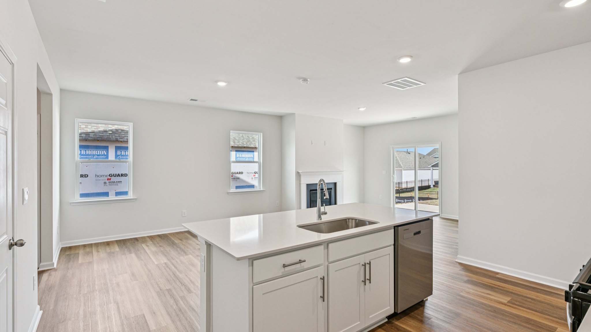 Kitchen and island with stainless steel appliances