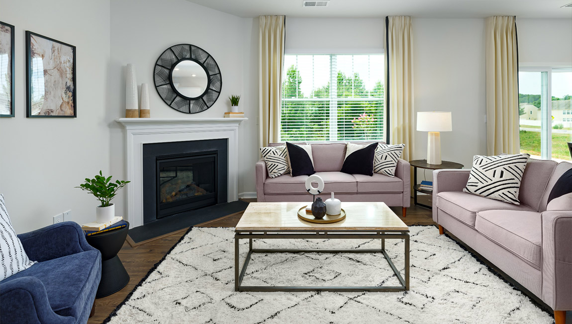 Open living area with fireplace and windows