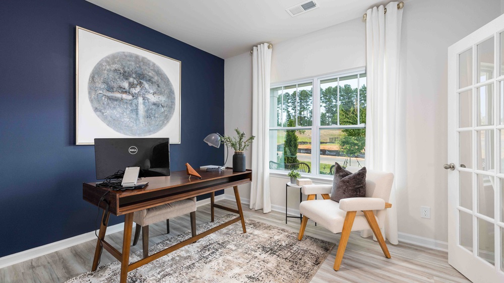 carpeted bedroom with large windows