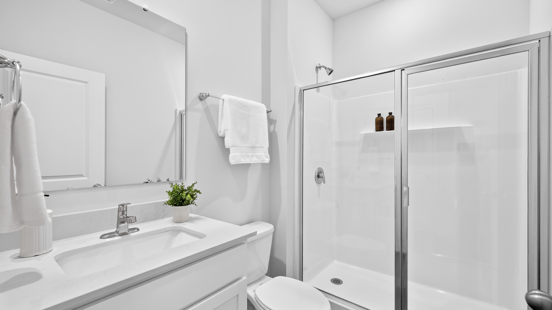 Bathroom with standing glass shower