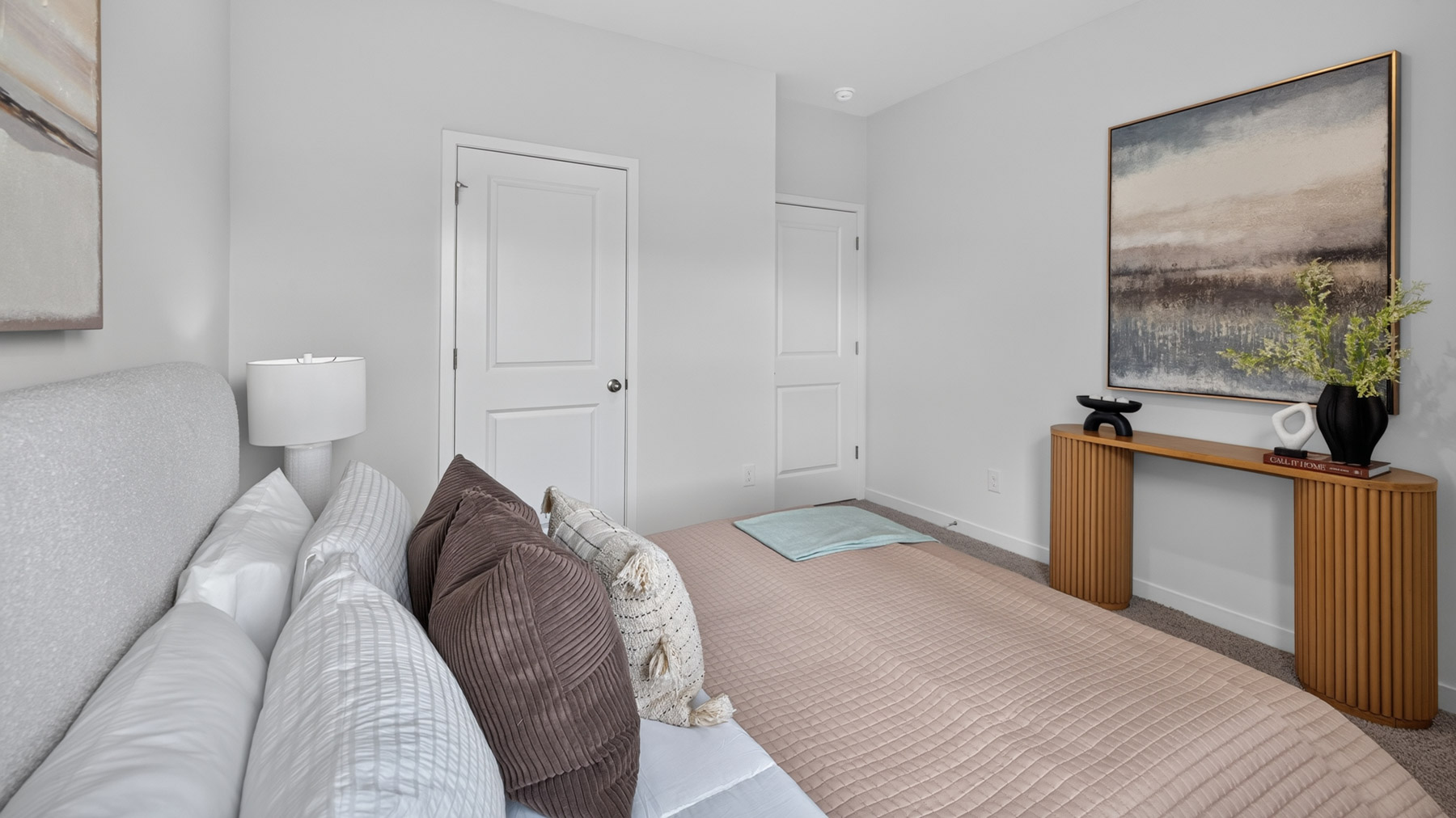 Carpeted bedroom with windows