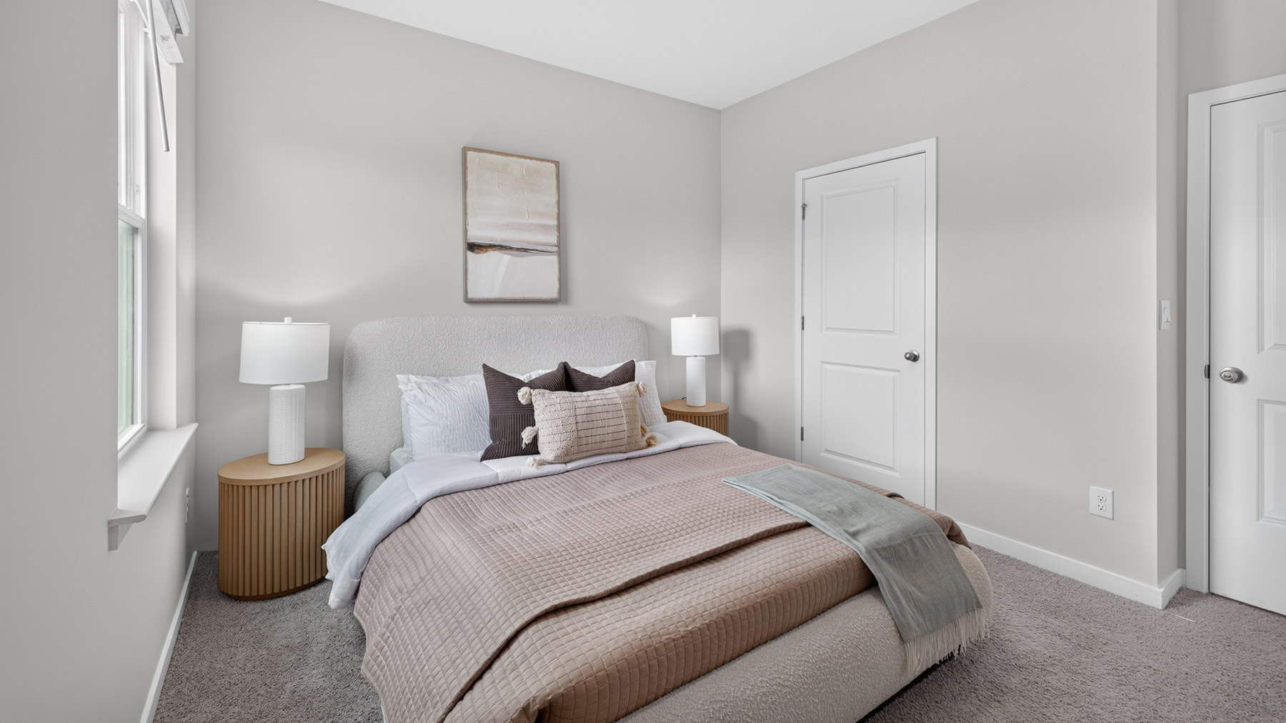 Carpeted bedroom with windows
