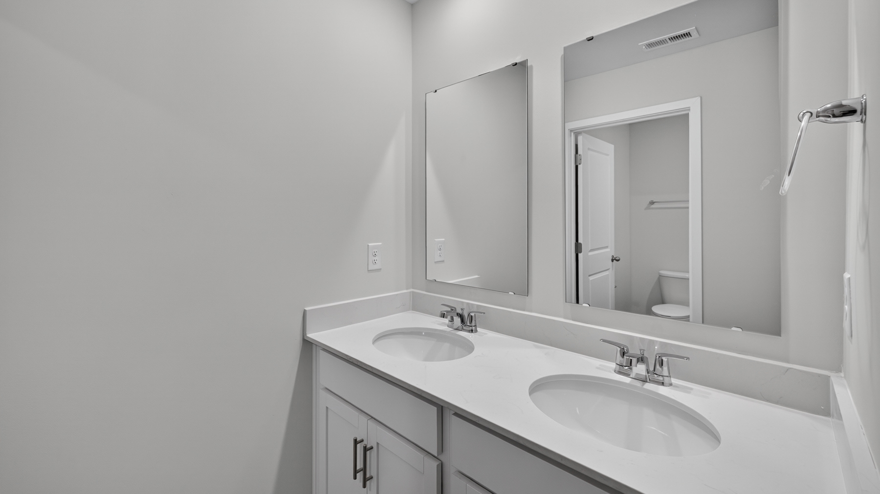 Bathroom with double sinks and tub shower