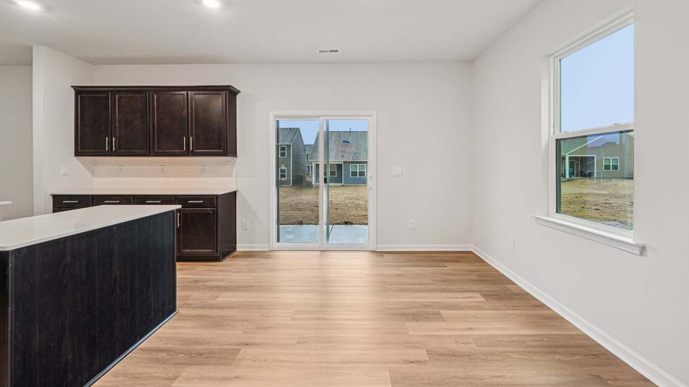Kitchen and island with stainless steel appliances