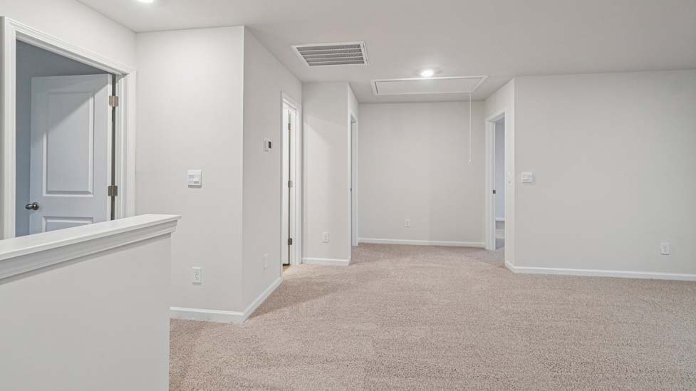 Carpeted upstairs loft area