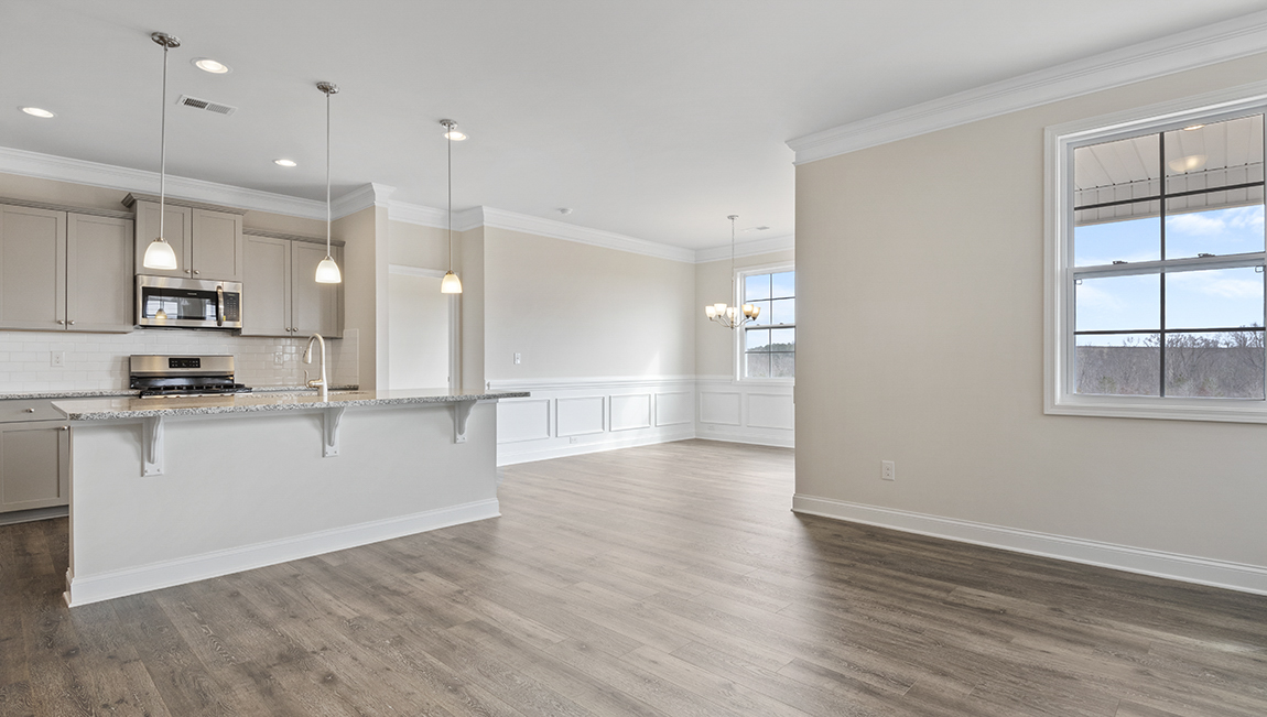 Living room space with large window and fireplace