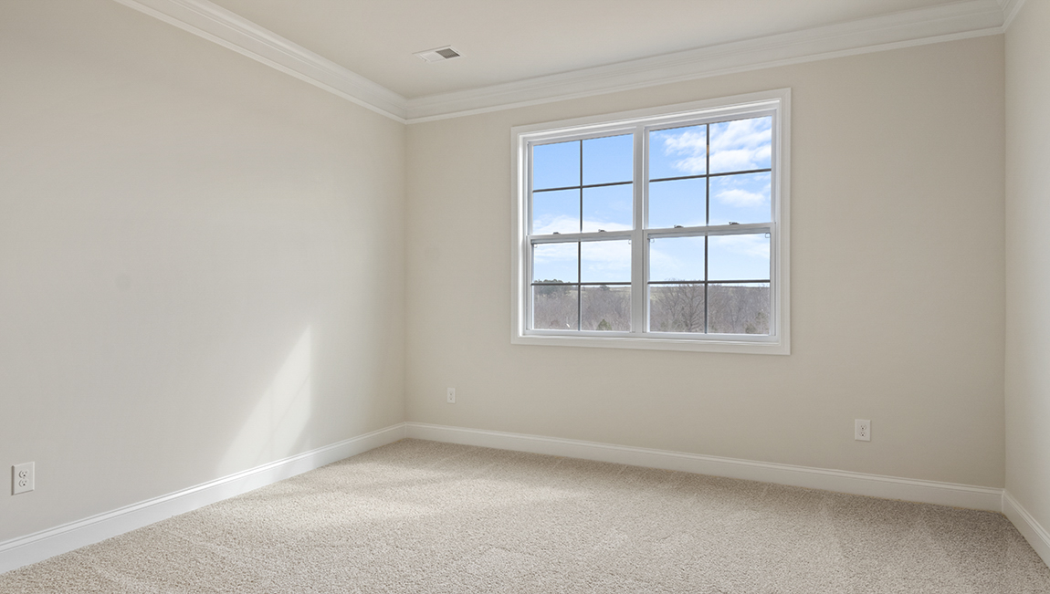 Living room space with large window and fireplace