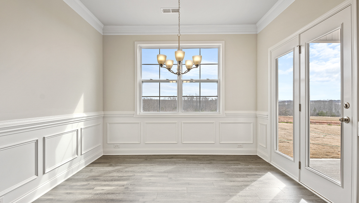 Kitchen and island, white counters and cabinets, wood floors