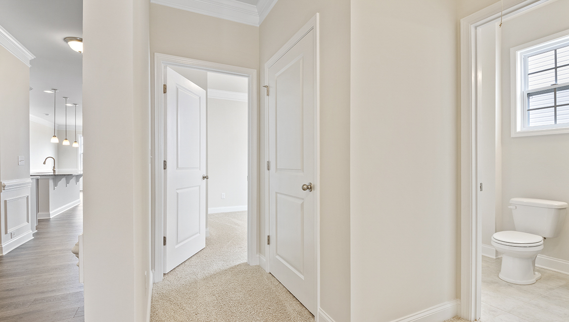 Carpeted bedroom with two windows