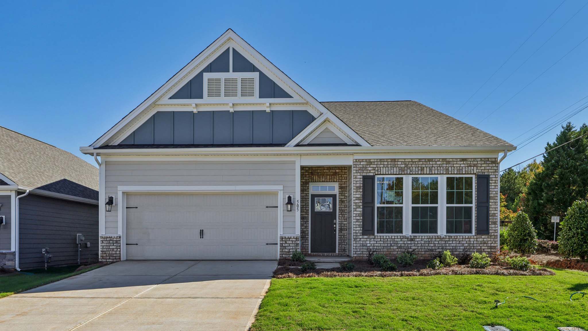 Azalea front exterior with siding and garage
