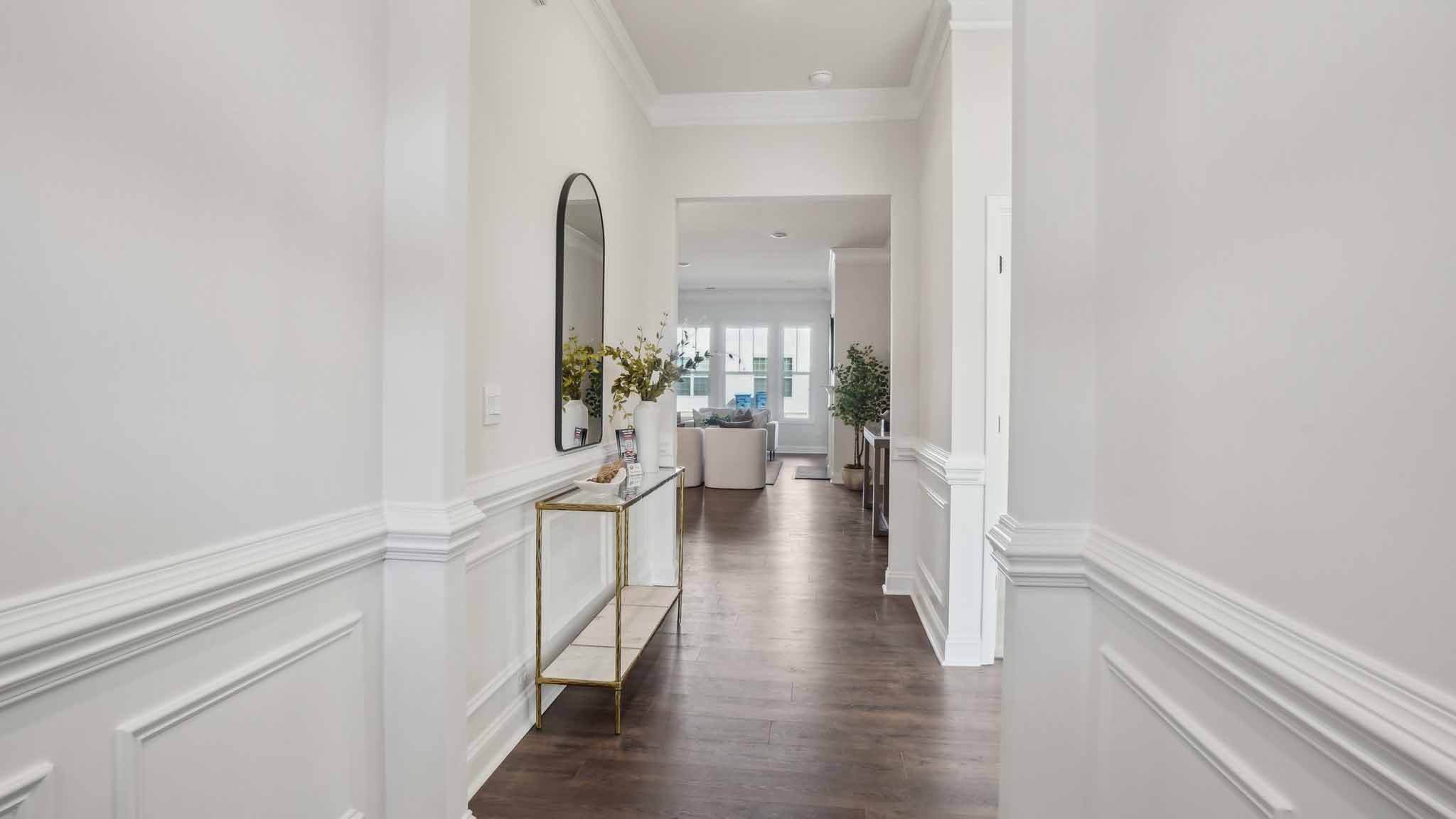 Welcoming foyer with wood floors