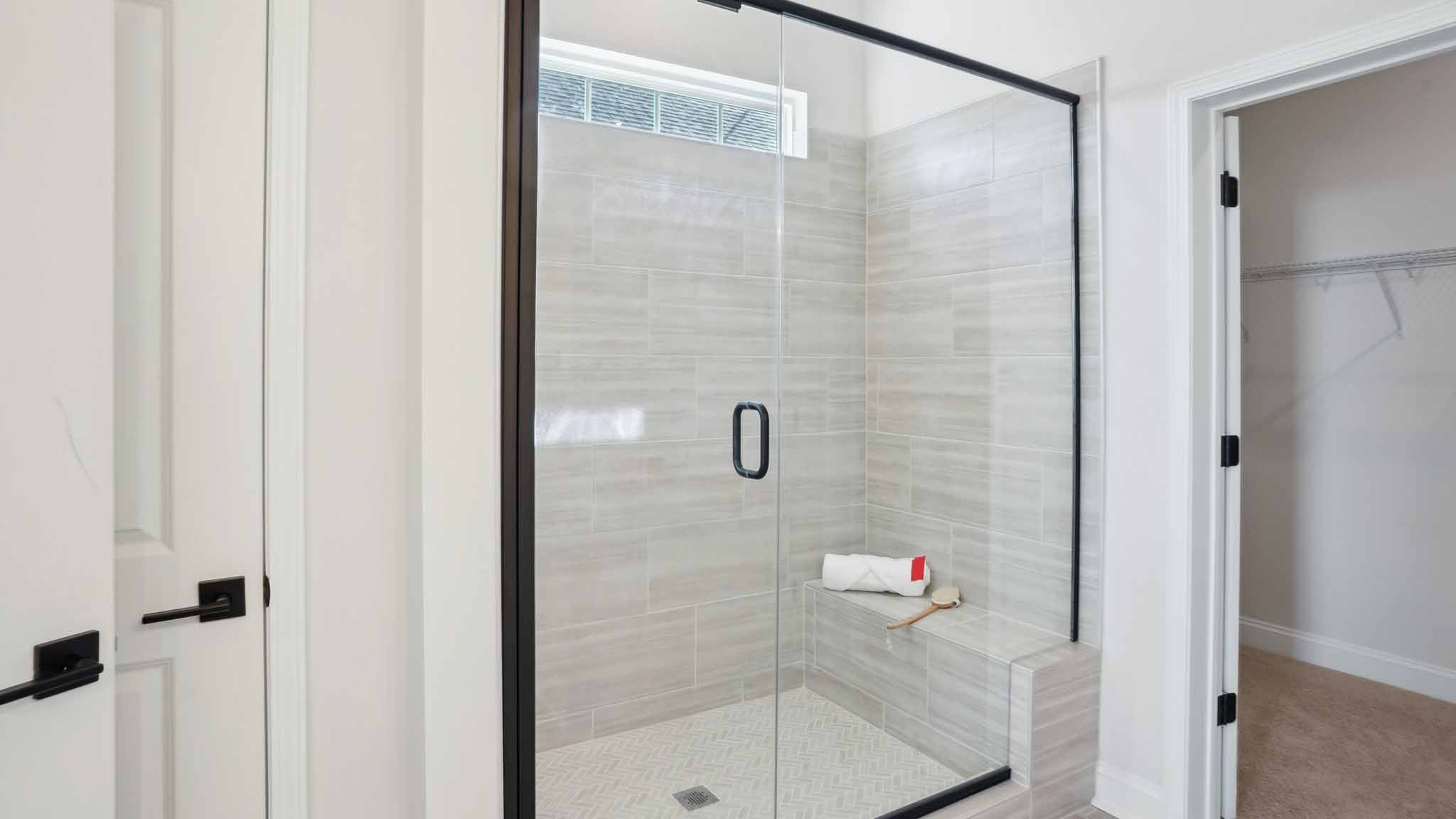Primary bathroom with large glass shower
