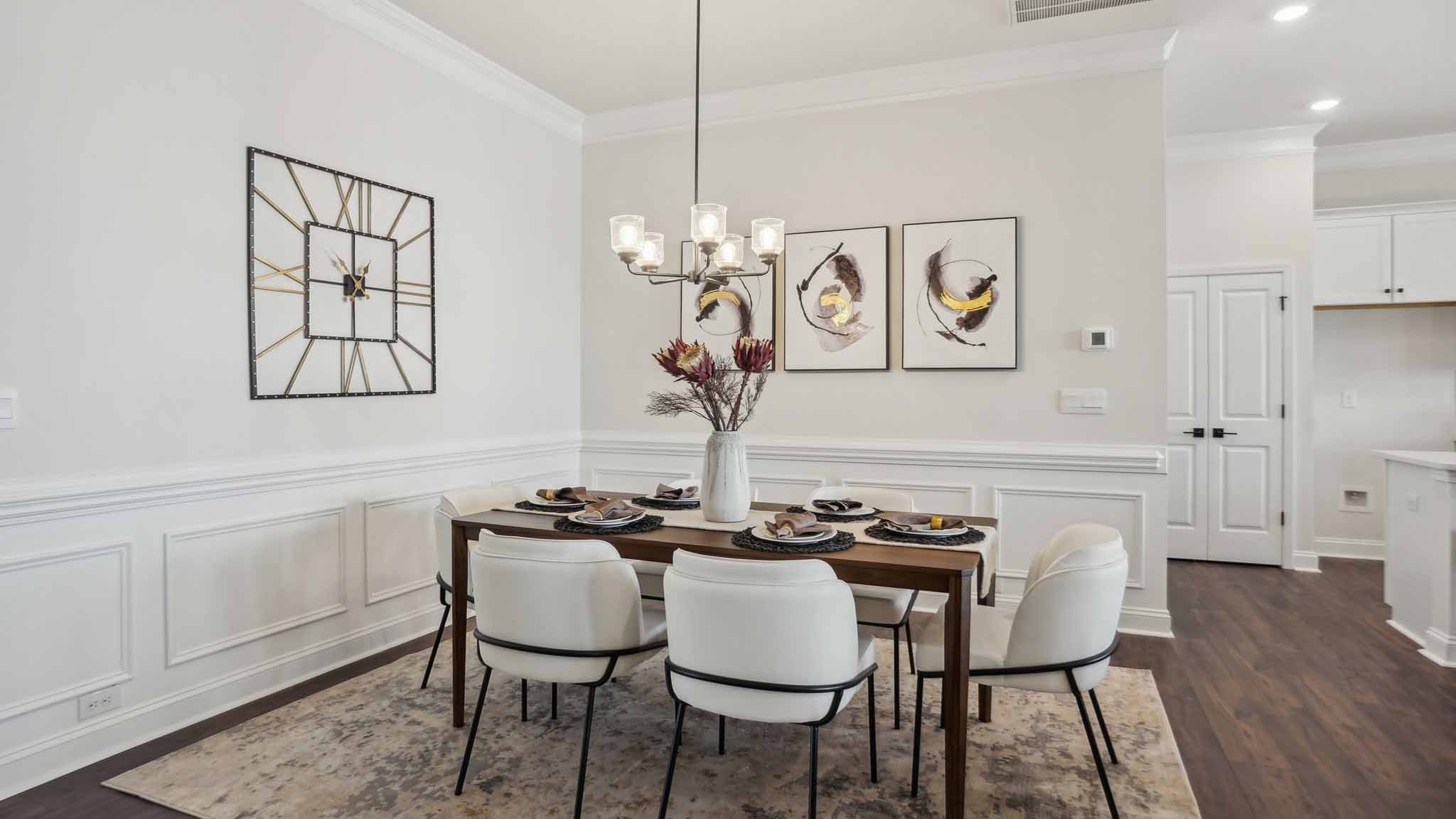 Dining area with wood floors and view of foyer