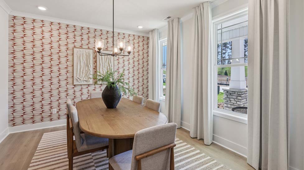Dining area beside kitchen with sliding glass door to backyard