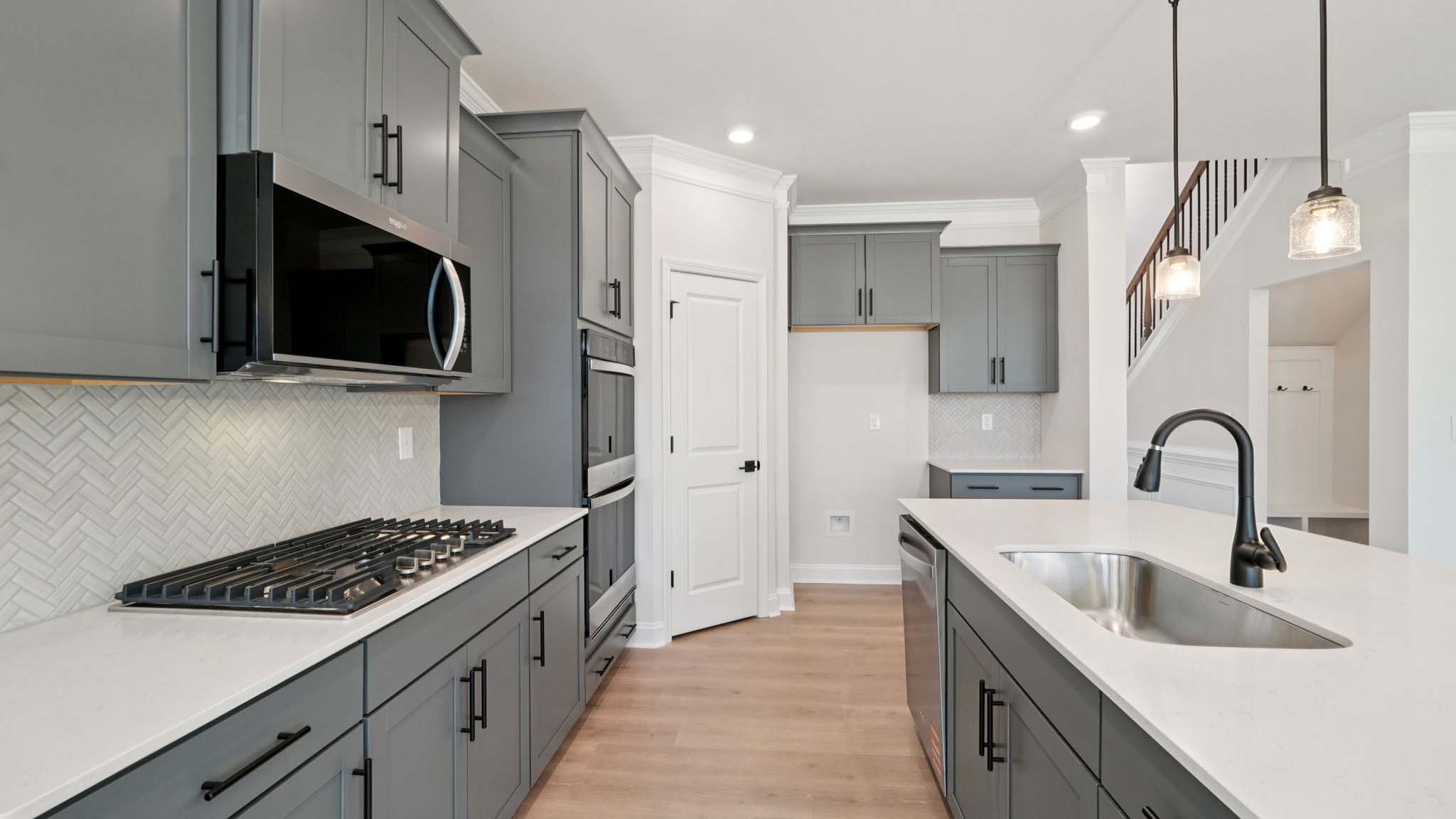 Kitchen and island with stainless steel appliances