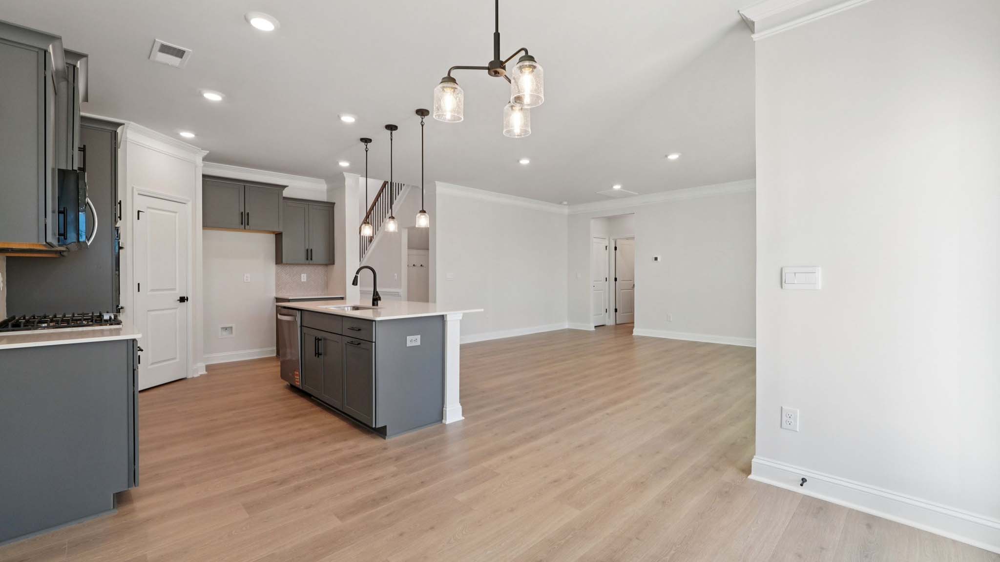 Kitchen and island with stainless steel appliances