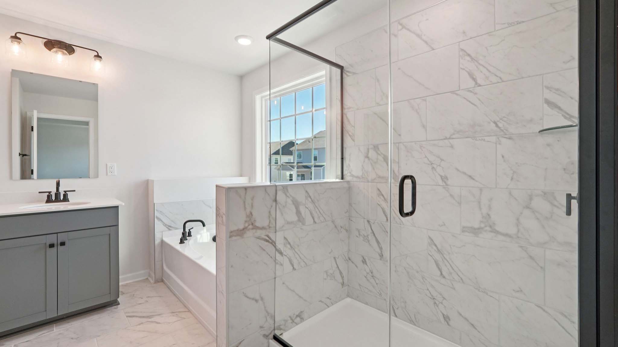 Primary bathroom with walk in shower and soaking tub