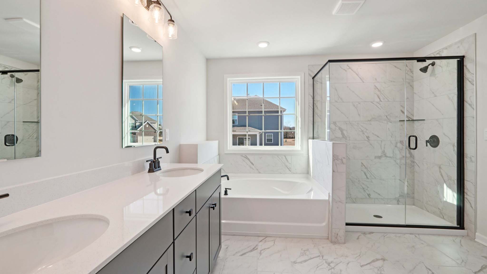 Primary bathroom with walk in shower and soaking tub
