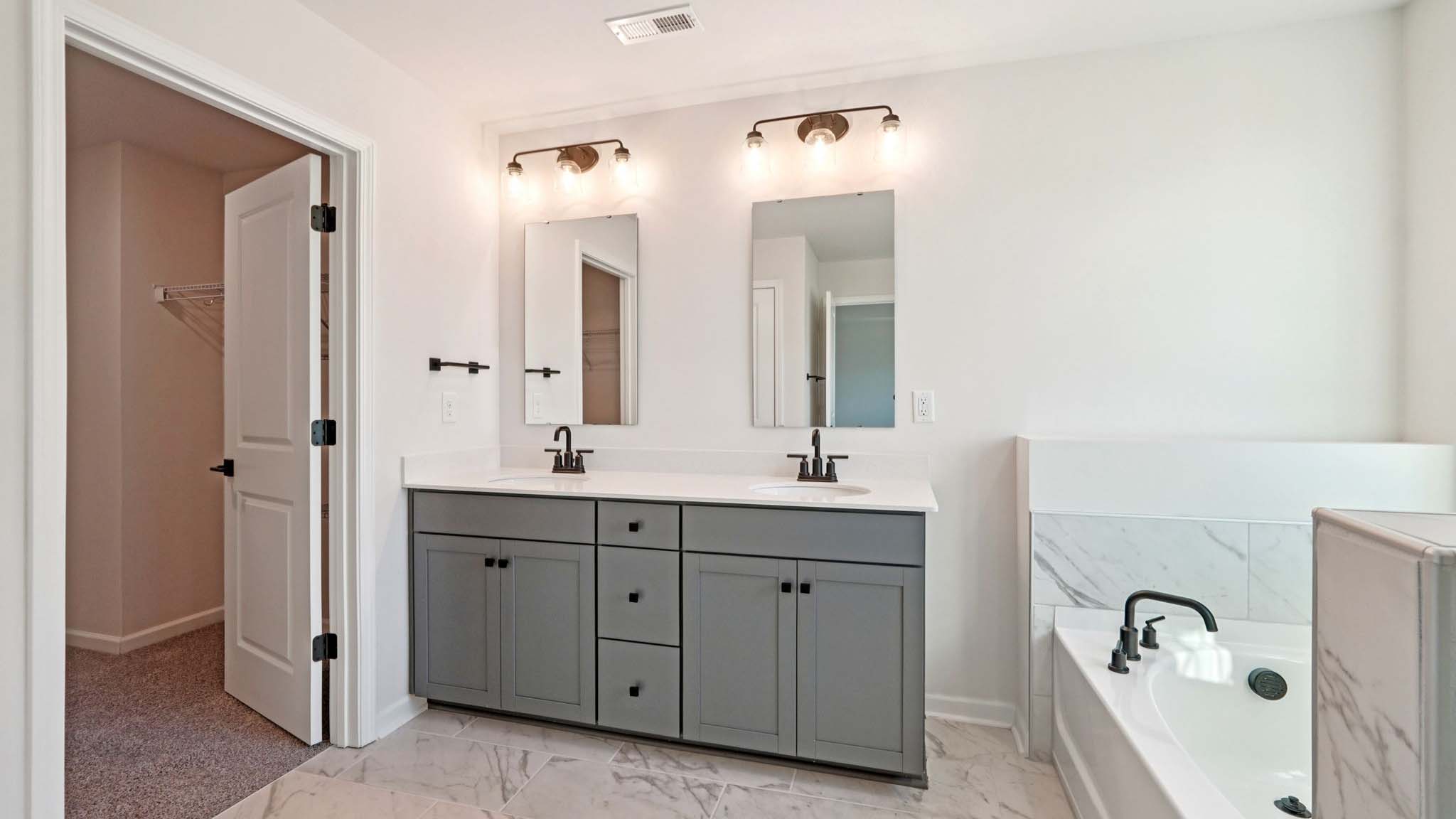 Primary bathroom with walk in shower and soaking tub