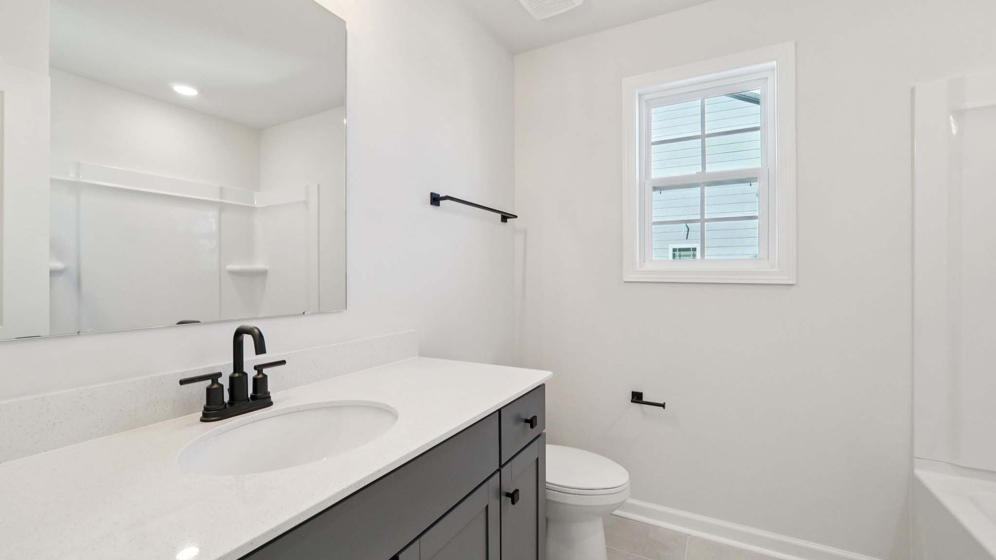 bathroom with bathtub shower combination