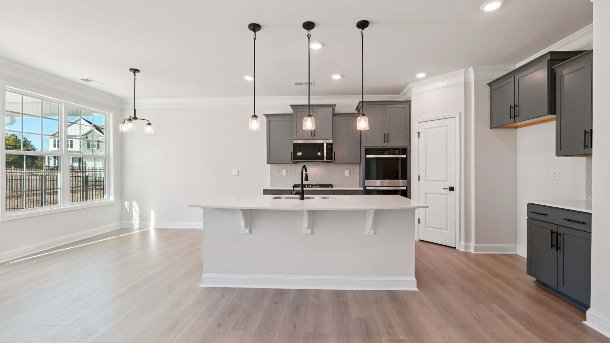 Kitchen and island with stainless steel appliances