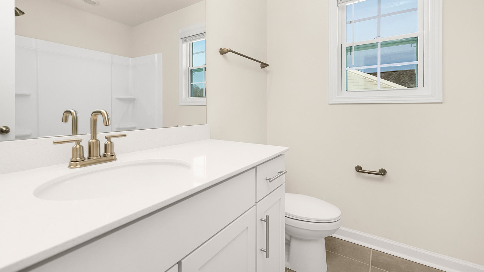 secondary bathroom with bathtub and shower combination