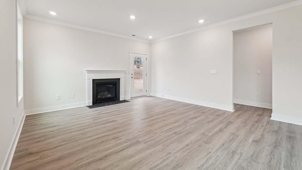 Living room space with large window and fireplace