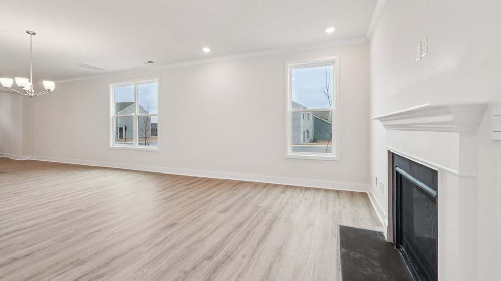 Living room space with large window and fireplace