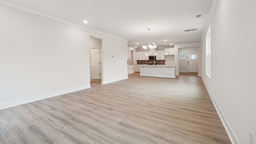 Living room space with large window and fireplace