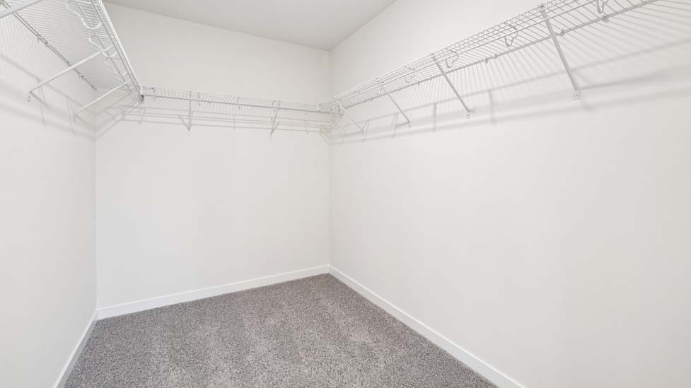 walk in closet, wood floors