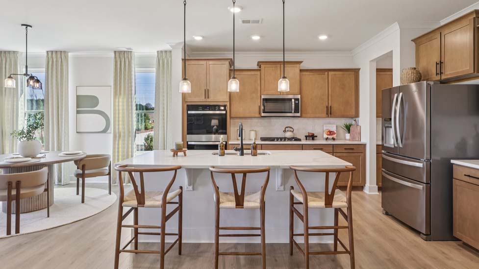 Kitchen and island with stainless steel appliances