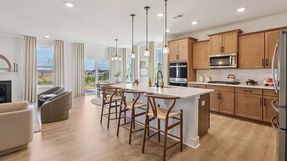 Kitchen and island with stainless steel appliances