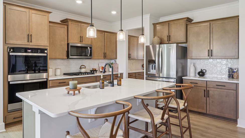 Kitchen and island with stainless steel appliances