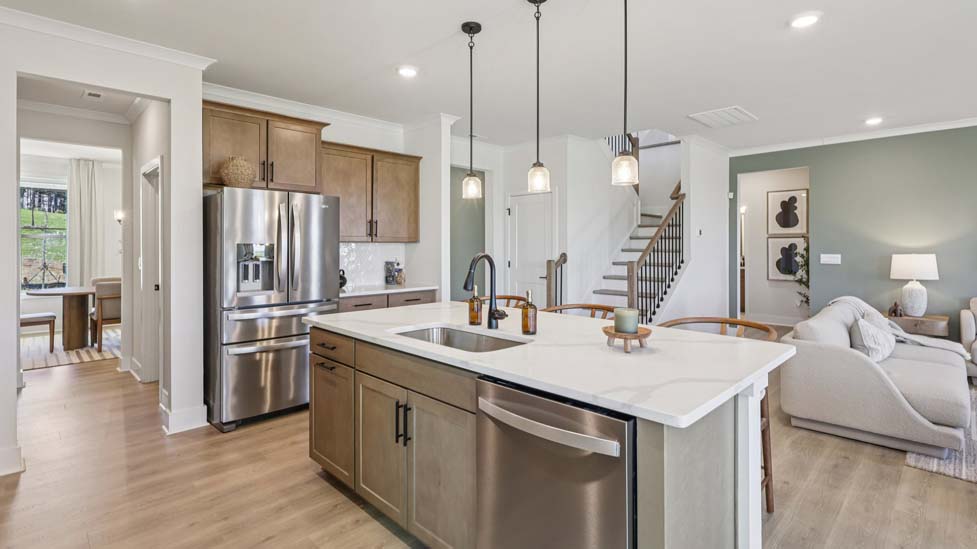 Kitchen and island with stainless steel appliances