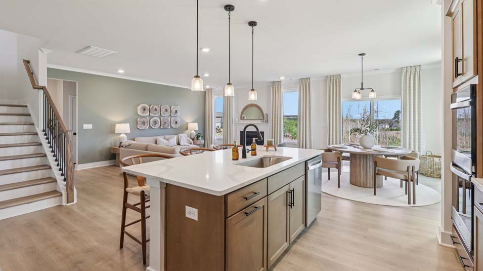 Kitchen and island with stainless steel appliances