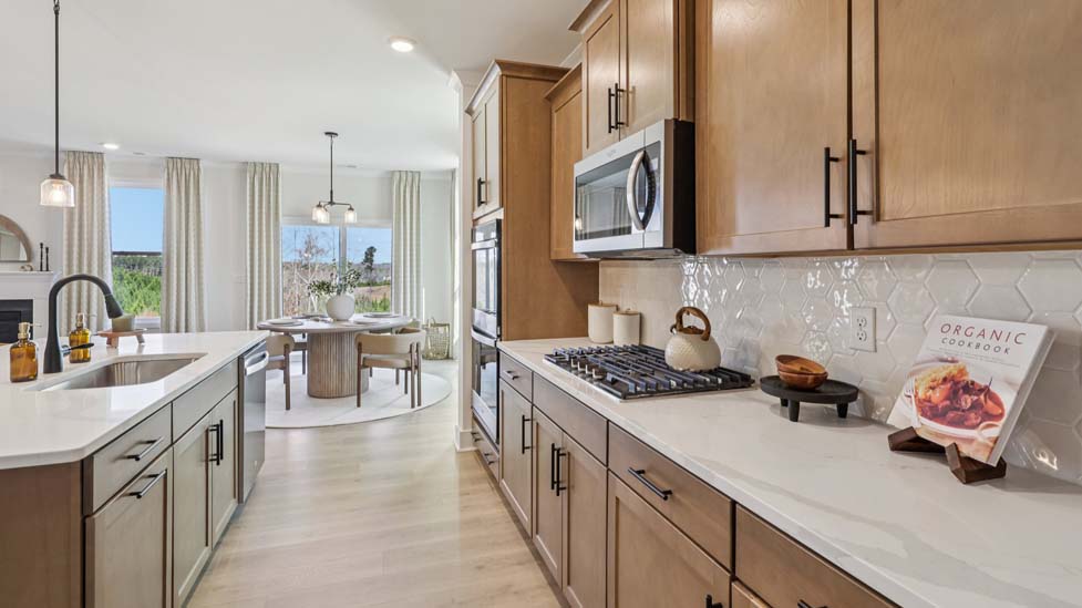 Kitchen and island with stainless steel appliances