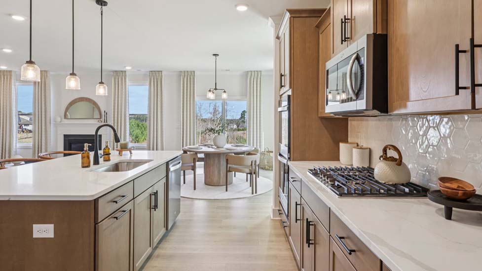 Kitchen and island with stainless steel appliances