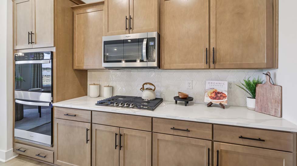 Kitchen and island with stainless steel appliances