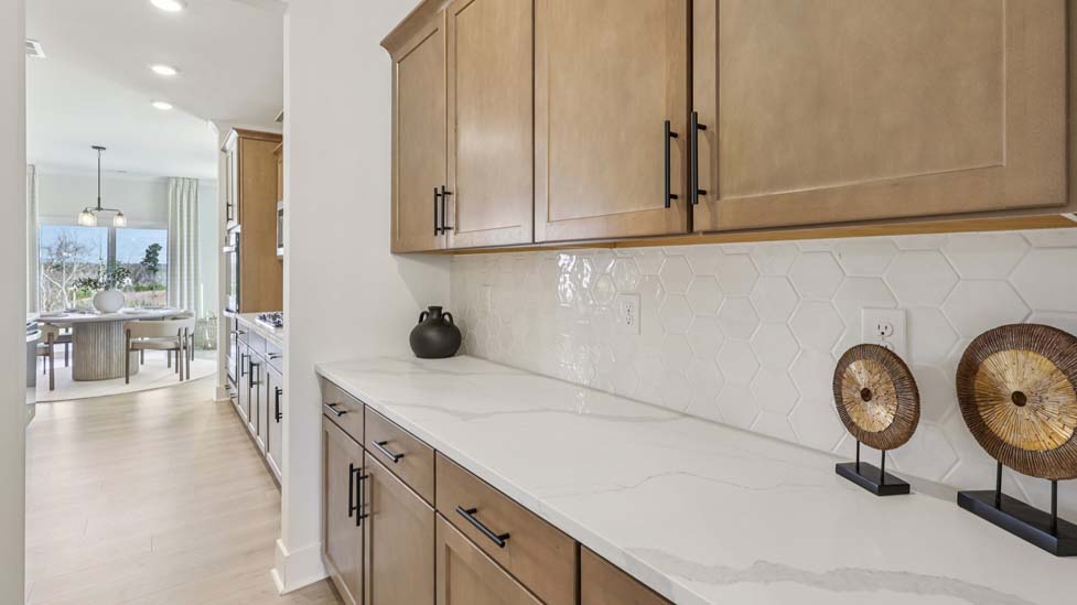 Kitchen and island with stainless steel appliances