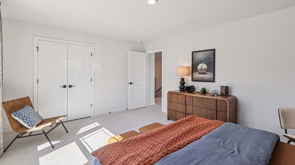 Carpeted bedroom with windows