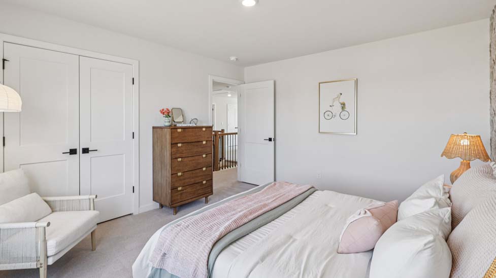 Carpeted bedroom with windows