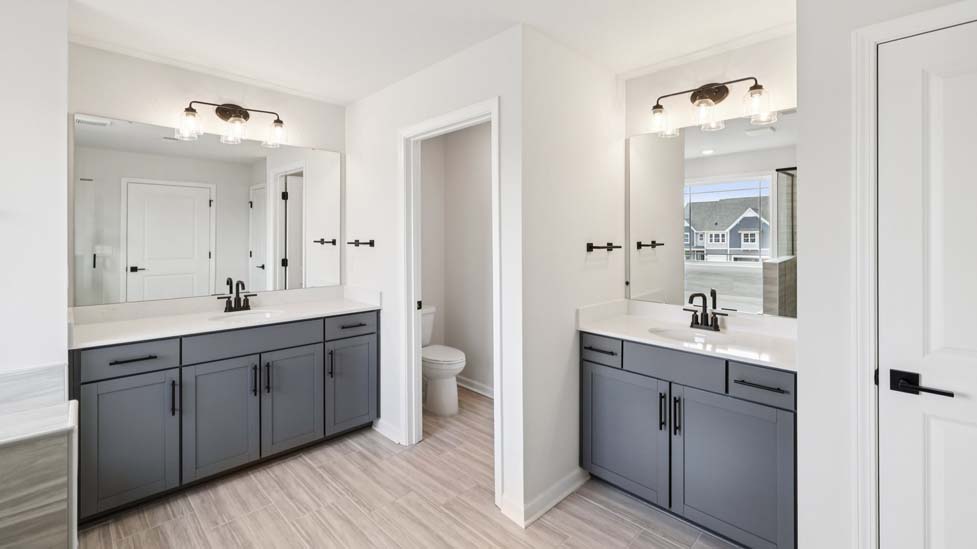 Bathroom with double sinks and shower