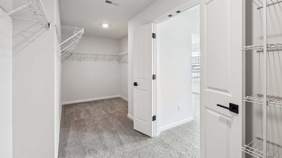 Bathroom with double sinks and shower