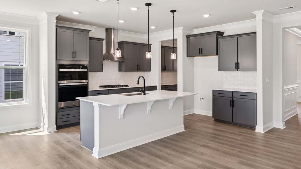 Kitchen and island with stainless steel appliances