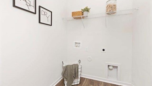 Laundry room with built in hanger and storage racks