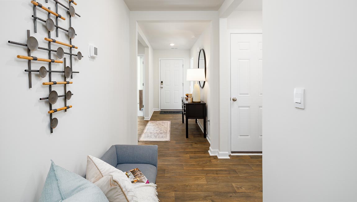 Welcoming foyer with vinyl flooring, view of interior. New Home in Charlotte, North Carolina
