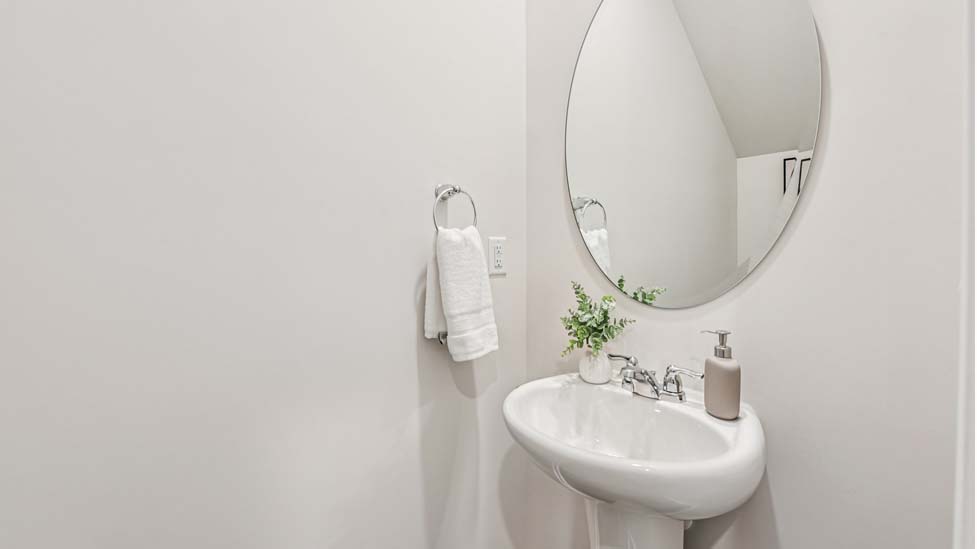 Powder bathroom with toilet and sink