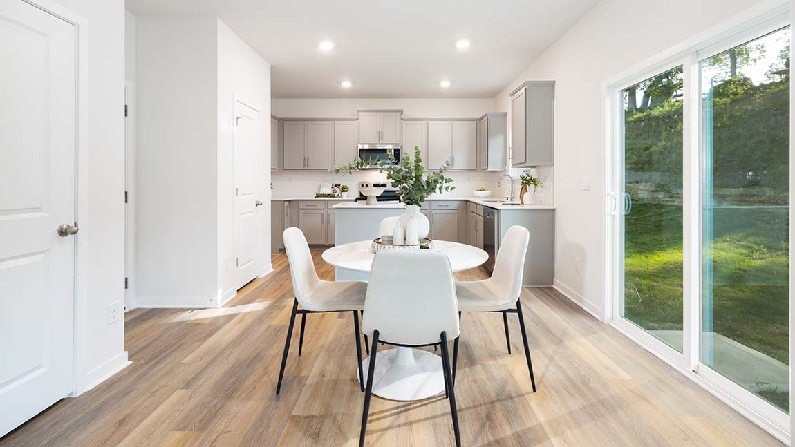 Breakfast space near kitchen, sliding glass doors beside