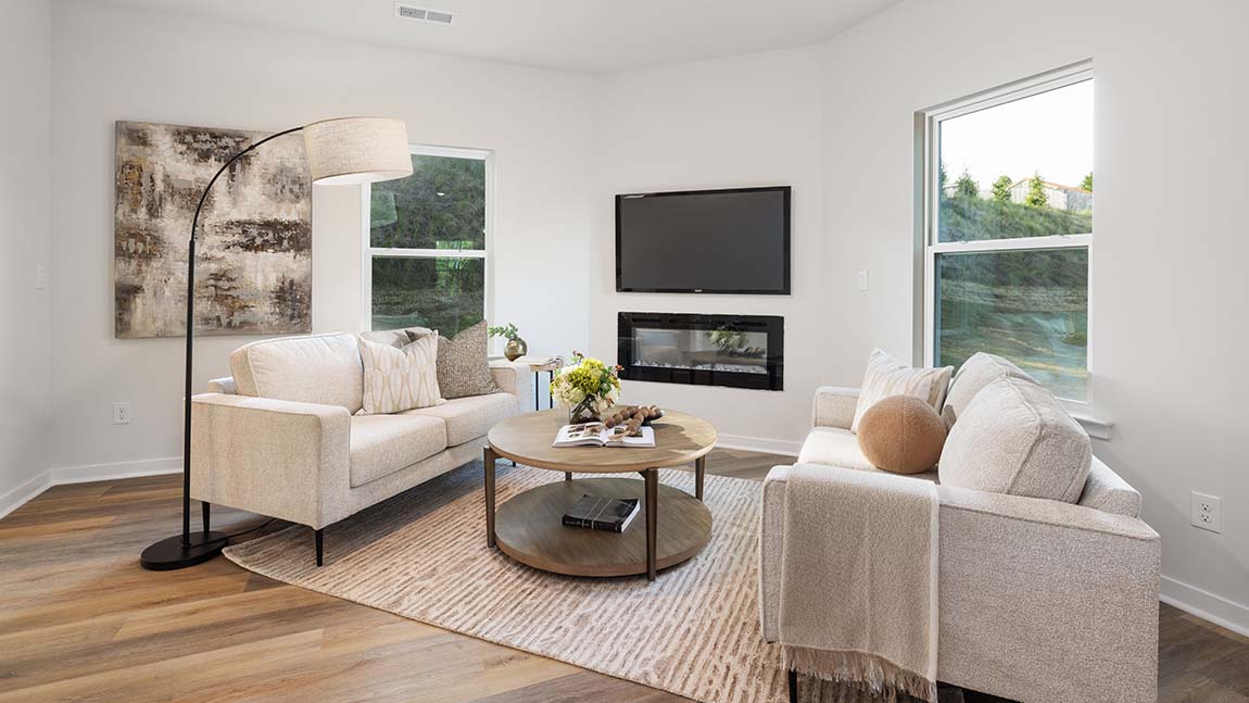 Family room with large windows and fireplace