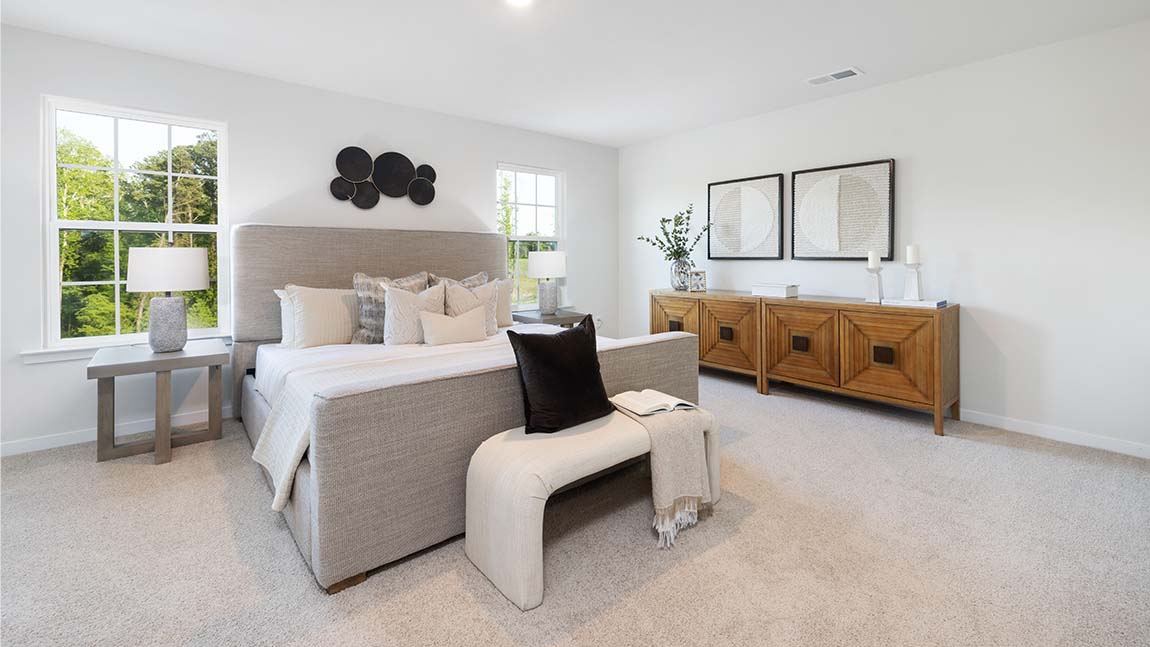 Primary bedroom, carpeted, two large windows